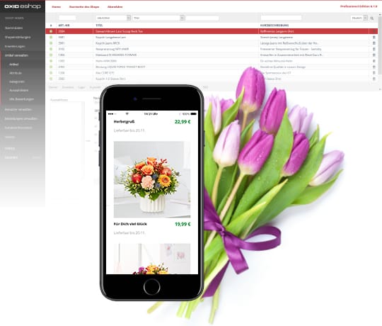 Das Backend der Enterprise Edition des OXID eShops. Im Vordergrund ist ein Smartphone mit einem geöffneten Shop.